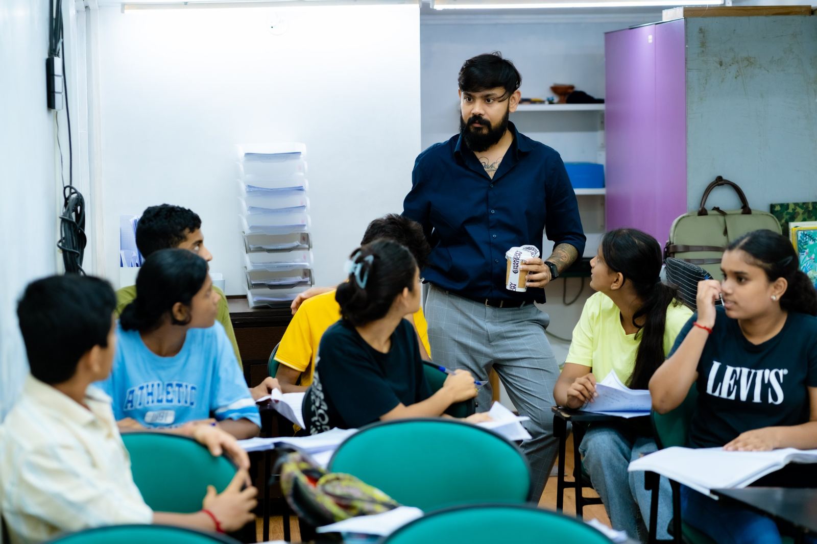 Jay Kothari talking with students in a TBTLC class