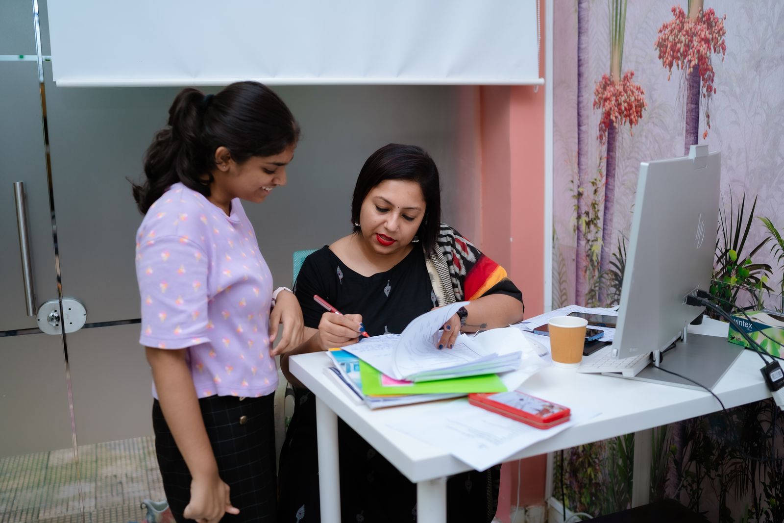 Urmi Kothari going through a student’s work with her one-on-one