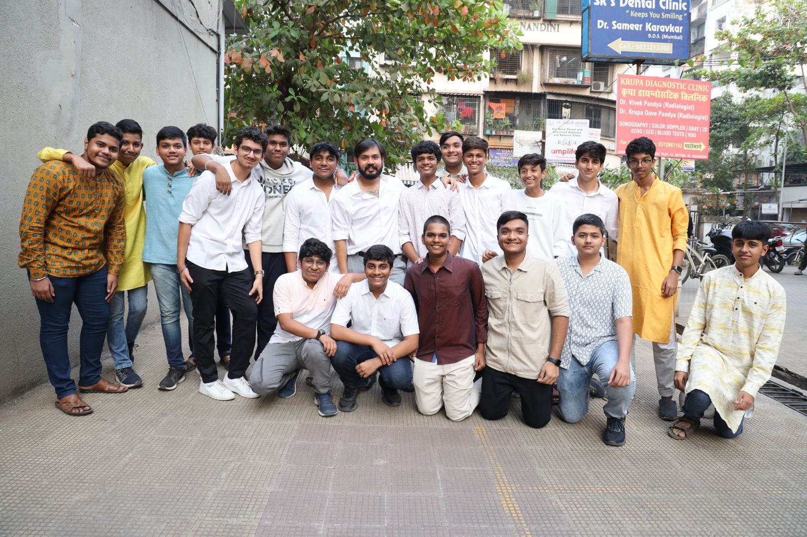 Jay Kothari with a group of TBTLC students outside the centre